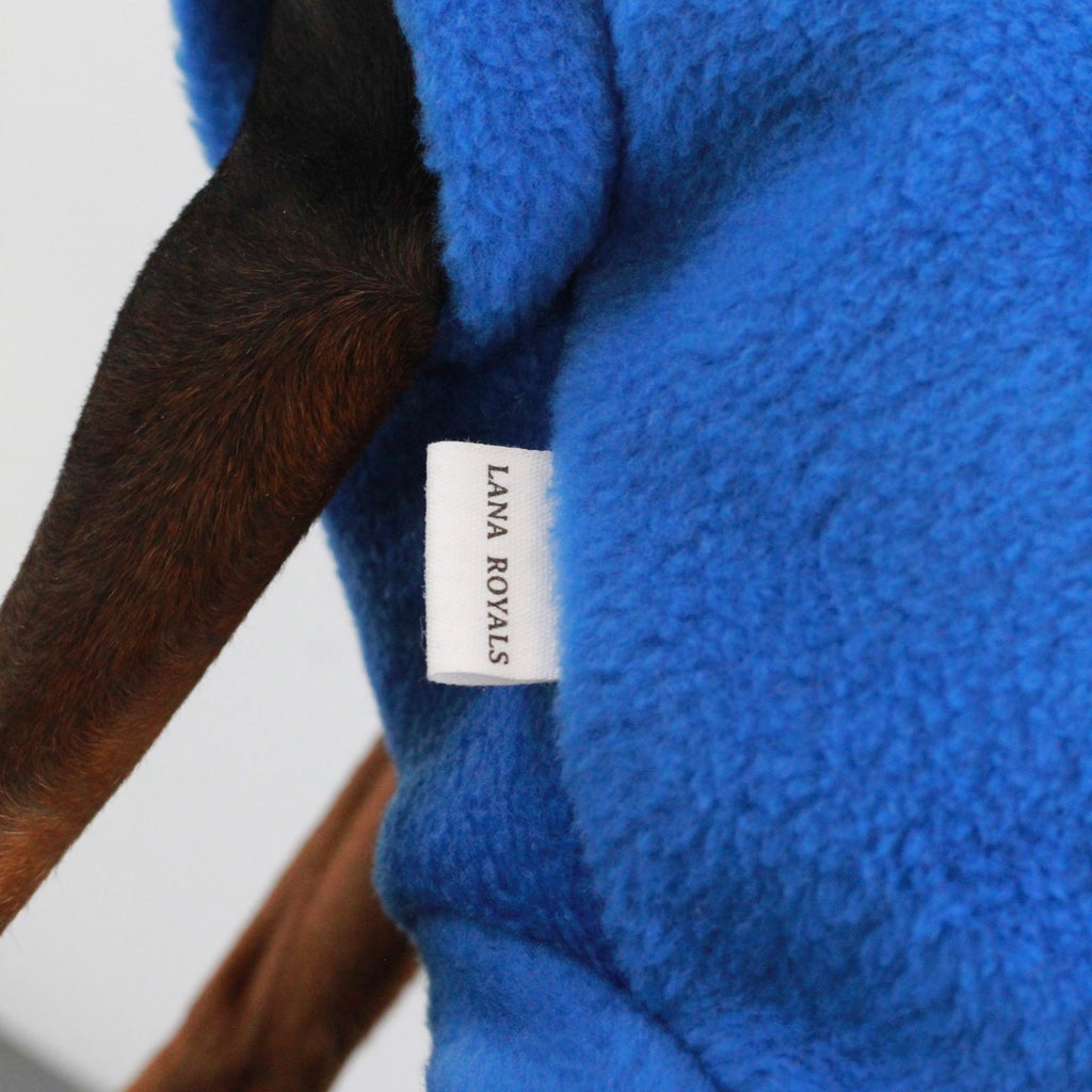 Royal Blue fleece dog sweater with a visible brand label of Lana Royals Pet Wear.