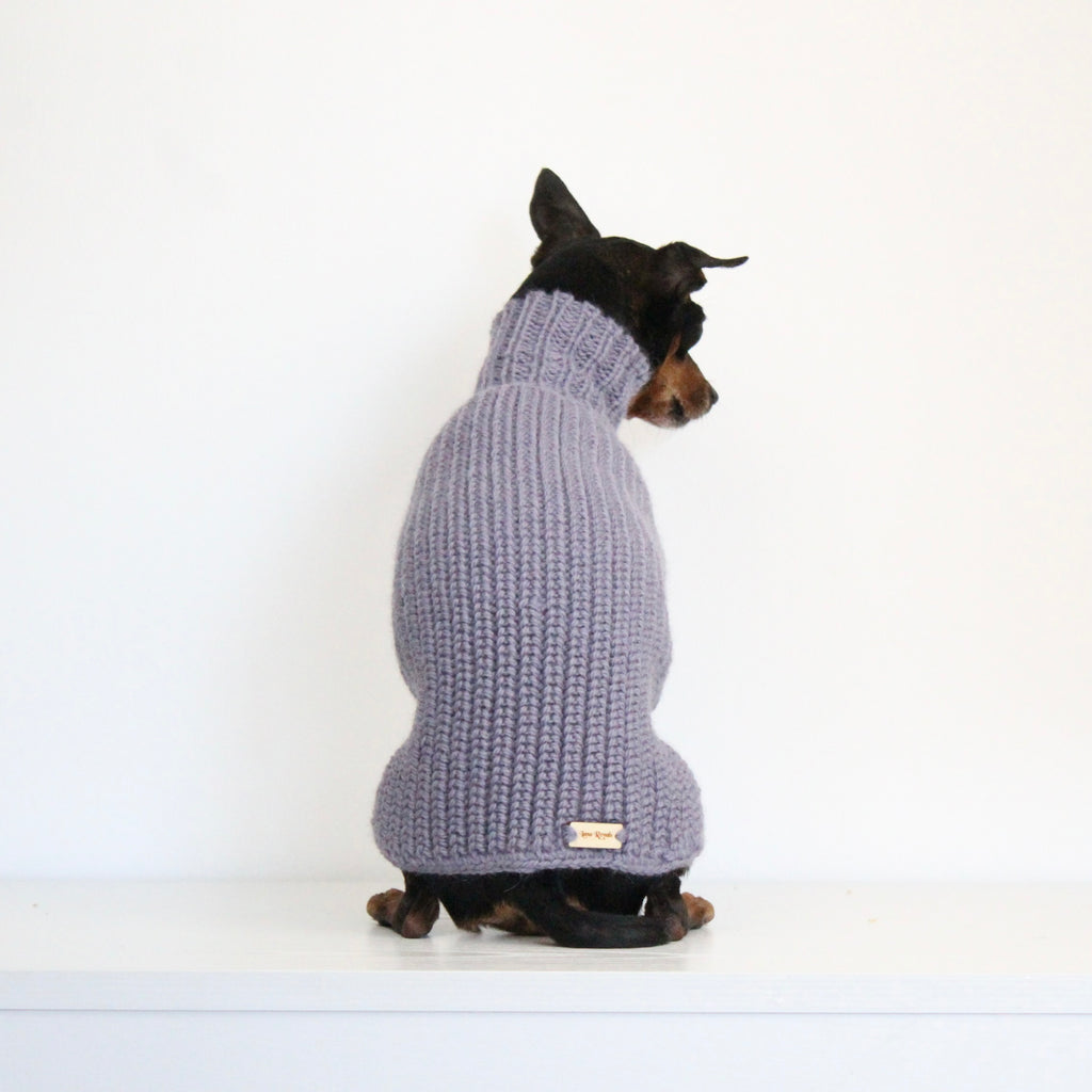 Small dog wearing a custom hand-knitted alpaca wool sweater 'MAYA' in grey lavender color, made to measure by Lana Royals Pet Wear.