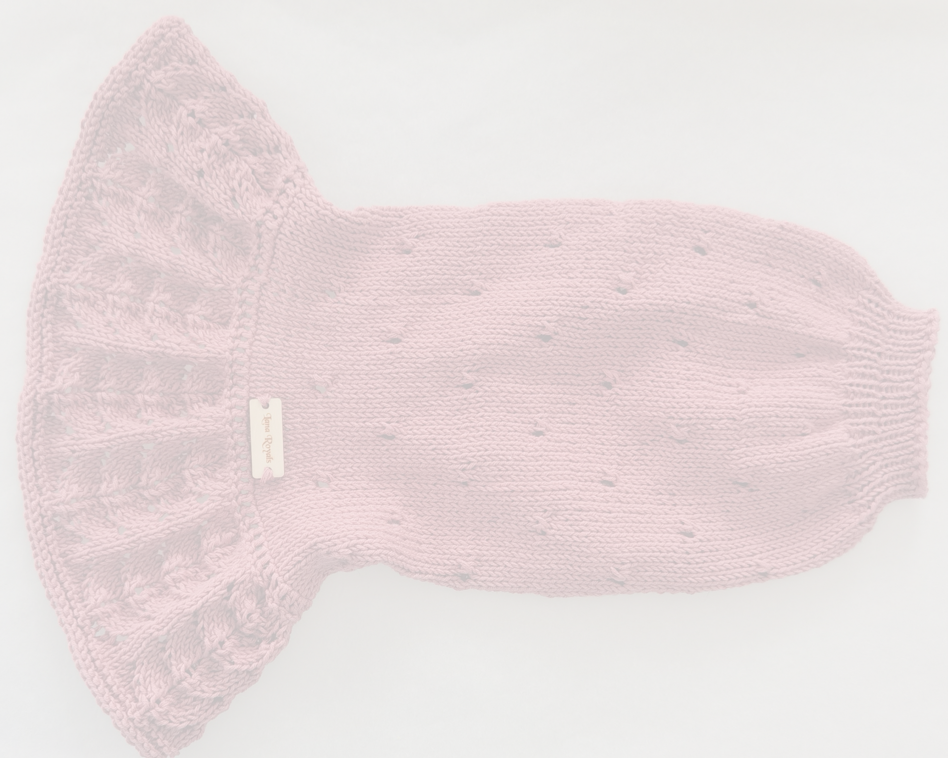 Pink knitted cotton dress on a white background. Custom handmade sweaters for dogs from Lana Royals Pet Wear.
